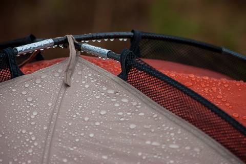 Water beading off a waterproof tent