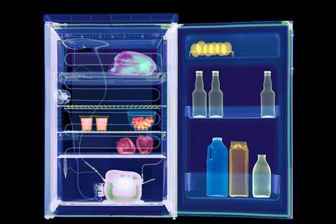 A coloured X-ray of a fridge showing the food and drinks inside and the cooling mechanism at the back