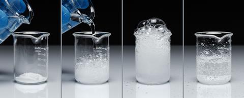 A series of photos showing a latex gloved hand pouring a colourless liquid onto a white powder, leading to a vigorous reaction of bubbles that then calms down