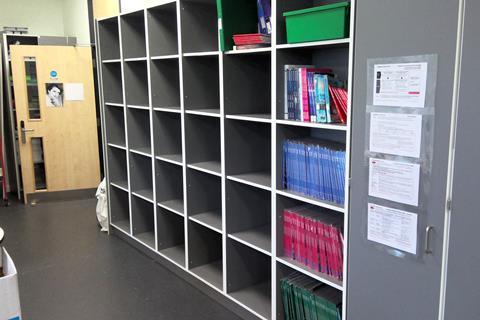 Cubby holes for textbooks and students' bags in a science classroom