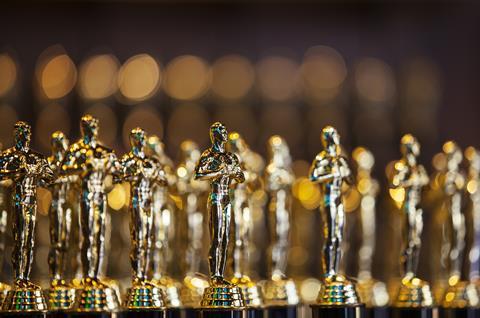 An image showing golden statues representing academy awards