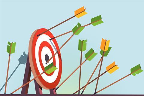 A cartoon of a target with many arrows, most have missed