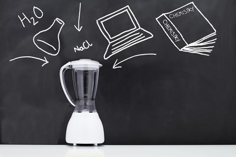 An image showing a food blender in front of a blackboard with chalk outlines of a laptop, Chemistry book and a flask