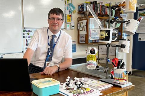 A teacher in a school lab