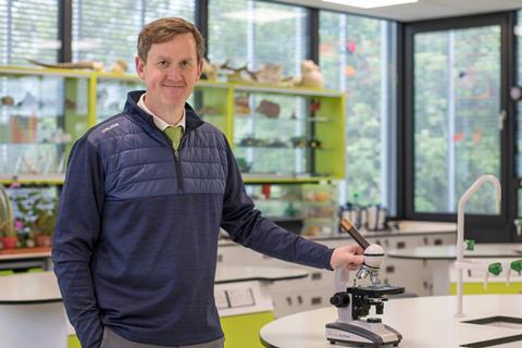 A science teacher in his classroom