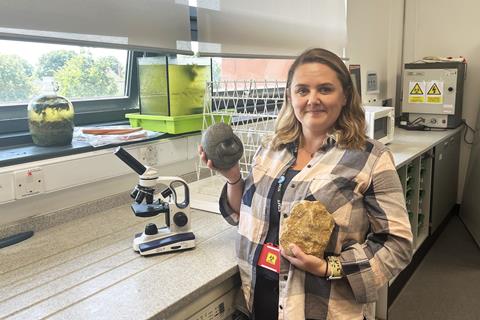 Lisa in a classroom lab with some geology samples