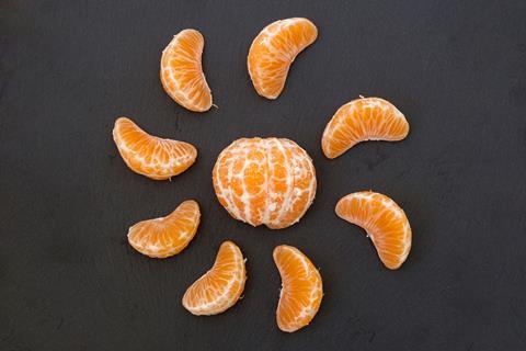 An image showing a sliced tangerine