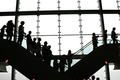 People on up and down escalators