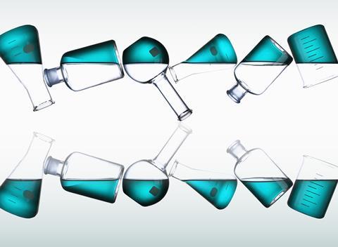 A row of chemistry glassware containing blue liquid, flipped and reflected
