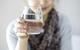 A lady holding a glass of clean drinking water