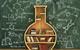 An image of a flask-shaped bookcase in front of a blackboard