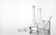 white background, glassware: flasks, beaker, stirring rod, petri dish