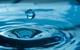 picture of a drop of water splashing to the surface