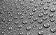 picture of drops of water on a teflon surface