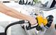 Person putting petrol into a car