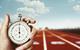 picture of a traditional stopwatch on a race track