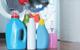 picture of a selection of laundry detergents in front of a washing machine