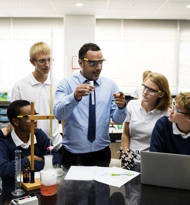 Science teaching doing a demonstration