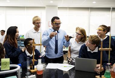 Science teaching doing a demonstration