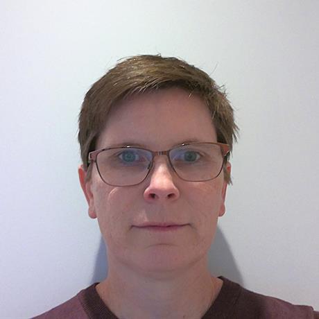A headshot of Catherine Smith against a neutral background